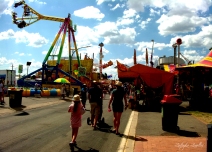 People head to the amusement rides at the Canberra Show