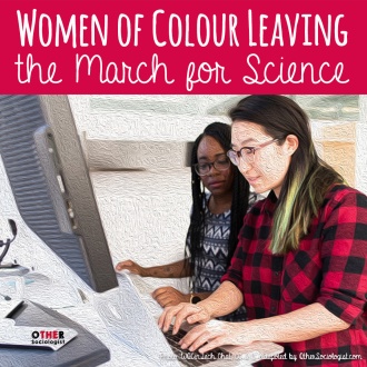 Two women of colour work together on a computer